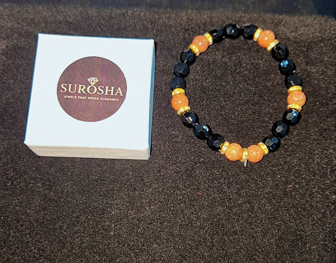 SuRosha armband met zwarte ogri ai kralen en zandsteen kralen