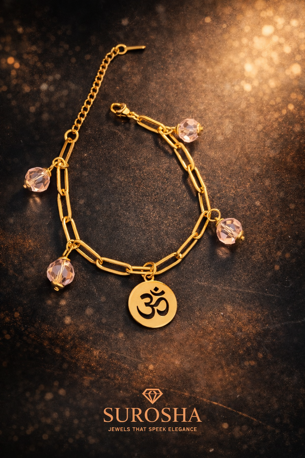 SuRosha Luxe Gouden Armband met Ohm Bedel & Helder Roze Kristal Kralen