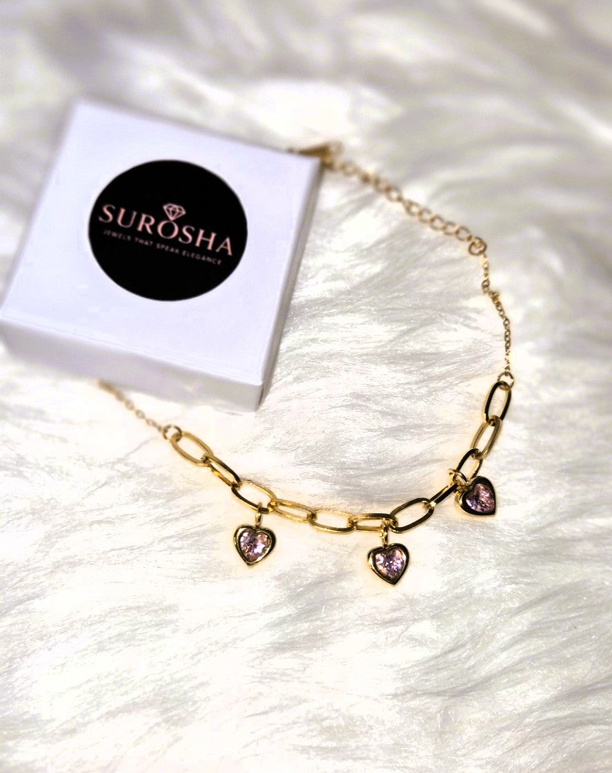 Luxe Goudkleurige Schakelarmband met Roze Hartbedels – Verstelbaar